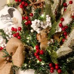 Christmas Charm επιτραπέζια χριστουγεννιάτικη σύνθεση σε μεταλλικό λευκό κασπώ με λαμπάκια μπαταρίας 22x22x59 εκ