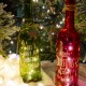 Χριστουγεννιάτικο επιτραπέζιο διακοσμητικό μπουκάλι κρασιού σετ των δύο σε κόκκινη και πράσινη απόχρωση με λαμπάκια led 29 εκ
