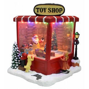 Toy Shop χριστουγεννιάτικο διακοσμητικό με σκηνικό Άγιου Βασίλη με παιχνίδια και ενσωαμτωνένο φωτισμό και κίνηση 21x18x22 εκ