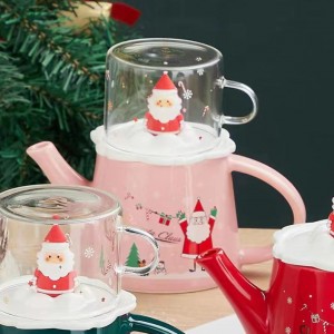 Santa Pink χριστουγεννιάτικη τσαγιέρα σε ροζ απόχρωση με καπάκι κούπα με Άγιο Βασίλη  Santa Pink χριστουγεννιάτικη τσαγιέρα σε ροζ απόχρωση με καπάκι κούπα με Άγιο Βασίλη