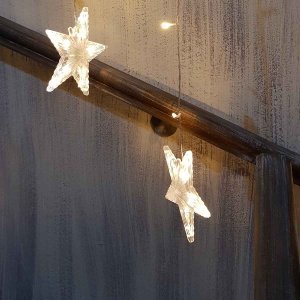 135 Led κουρτίνα ασύμμετρη με αστέρια διάφανο καλώδιο και θερμό λευκό φως 200x140 εκ